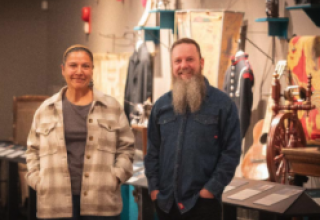 two people standing in a museum